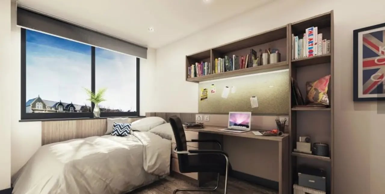 Bed desk and bookshelves student bedroom at Trinity View Coventry in Coventry Student Accommodation
